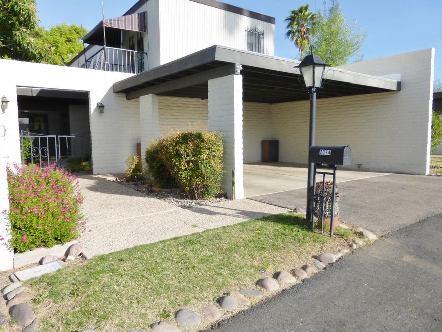 Wonderful Northeast side home, move-in ready townhome. Three large bedrooms.  One on the main floor. Two full bathrooms. One upstairs bedroom has French doors leading to the balcony that overlooks a beautiful front courtyard, the other has a stunning mountain view.  Kitchen has an enormous picture window looking into the courtyard, large center island, granite counter tops,stainless steel appliances, a large pantry and an abundance of solid wood cabinetry. Home has separate laundry room and dining room.  Living room has a show-stopper round fireplace with wrap around stairs and a gorgeous wall of glass patio doors leading to a covered patio and a fully private park-like back yard.  Mature citrus tree and stunning flower beds complete this back yard paradise. This is a must see home!