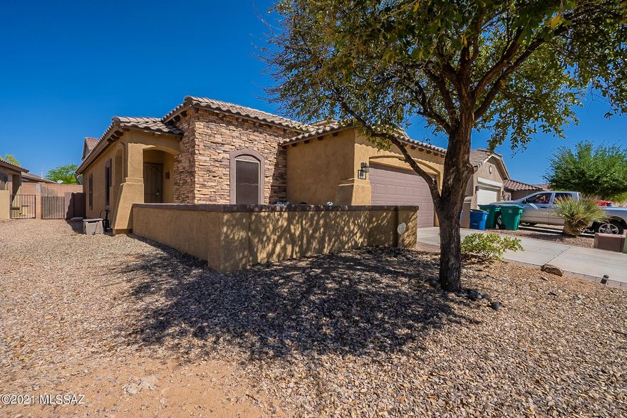 Welcome to your new home! This is a move in ready 4BD/2BA. This home boasts a wonderful open concept floor plan.  The family room flows into the open kitchen area that features SS appliances. The backyard is also very spacious with a fire pit and room for much more.  Located in the highly popular Rancho Sahuarita. This home is conveniently across from one of the many neighborhood parks.  Included with your HOA are community pools, basketball courts, water park, walking trails and a clubhouse with a full gym!  This one won't last long! Come and see this beauty TODAY!