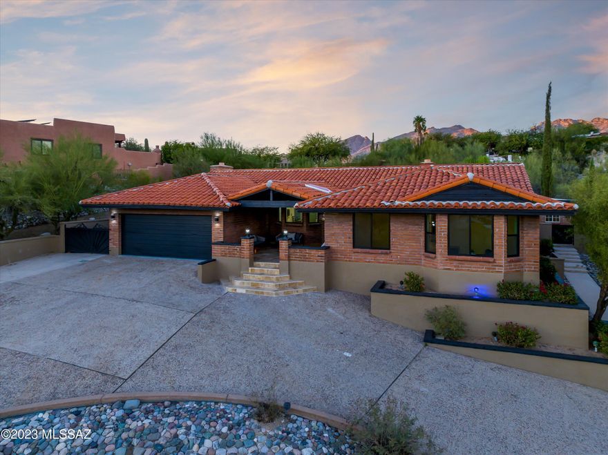 Hill Top Custom Home - Stunning City Views with HUGE Entertainers Back-Yard, 900 SqFt Covered Patio, Green turf, Sparkling pool & waterfall. Immaculately Updated: Brand New Cabinetry, Quartz Countertops, Luxurious walk-in Showers & upgraded dual pane Doors & Windows! Enjoy time with loved ones in the over-sized Family Room featuring wet bar, Quartz bench seating around a wood burning fireplace. Stunning City Views, spacious rooms, a true hill Side Gem!