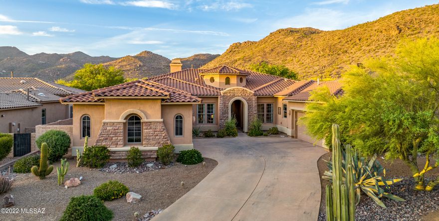 Stunning 2006 Toll Brothers single story, 4 bedroom, 3.5 baths, plus library/den home is located in The Gallery at Dove Mountain's gated subdivision, Solana. An arched entry leads to the front walkway flanked by desert plantings. The front door opens into a grand circular foyer with clerestory windows and cathedral height ceiling.  Contemporary paint colors, arches, and 8' interior doors and natural light create a warm and airy atmosphere.

The great room is an entertainers' delight with 2 living areas featuring a media space and floor to ceiling stone gas fireplace, The newly remodeled dry bar features new granite, glass backsplash and wine/soda fridge. Enjoy breathtaking mountain and sunset views from the great room, kitchen and dining areas. The newly remodeled kitchen has new granite countertops, glass tile backsplash, 5 burner gas THERMADOR cooktop with downdraft, double wall ovens, built in microwave, single stainless steel basin sink with a touchless pull down sprayer. Kitchen island has built in phone charging stations with pop outlets.  Walk-in pantry is ample sized to hold food, dishes, small appliances and pantry staples.

No need to go to a resort as this private elevated lot features a Pebble Tec salt water pool with grotto, waterfall, slide and baja shelf.  A free-standing hot tub with LED lighting, gas firepit and BBQ area are flanked by mature desert landscaping and fruit trees: fig, Sumo mandarin orange, pomegranate, and limequat.  The home is designed to maximize indoor/outdoor living at its best!

Expansive master bedroom with sitting area,floor to ceiling stone gas fireplace, plantation shutters, and his and her walk-in closets.  The en-suite features double vanities, an oversized walk-in shower, jetted tub, separate dressing vanity, and private water closet with additional storage. 

Split floor plan features a guest suite with private en-suite and 2 additional bedrooms. The master and 2 bedrooms have wood like ceramic tile flooring while the 4th bedroom has plush carpeting.

The home features an attached 2 car garage as well as a detached 2 car garage perfect for the car enthusiast, studio, workshop or fitness area.

This is a must-see home!