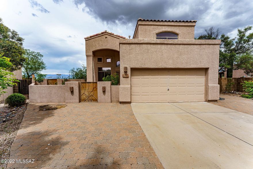 Open floorplan with a large family room, dining room and extra living room and a Grand staircase and high ceilings. These 5 bedrooms (one downstairs) and 3 bathrooms is a fantastic home for any family.  The master bedroom suite has new flooring, two closets, a garden tub, dual sinks w/ new faucets and a walk in shower and balcony. Kitchen has stainless steel appliances which include a new gas range, new stainless-steel sink, microwave, dishwasher, and a French door refrigerator.  Granite countertops and a center island with seating for 3. One of the largest lots in the subdivision at 10,332 sq. ft, surrounded by a block wall and lots of vegetation. Great mountain views. Beautiful fenced pool with spa and a Variable speed pump.  Large covered patio and a fire pit with large concrete deck. New interior Paint, New toilets, vanity lights, faucets and no carpet..... Courtyard entry, two car garage and a large concrete driveway.