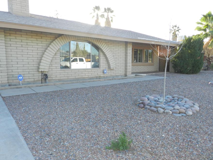 Northwest Tucson - 3 bedroom, 2 bath, all tile floors, living area with fireplace, large kitchen, 2 car garage, extended covered patio, professionally landscaped backyard with mature vegetation, no HOA. Pets considered. Move in ready.