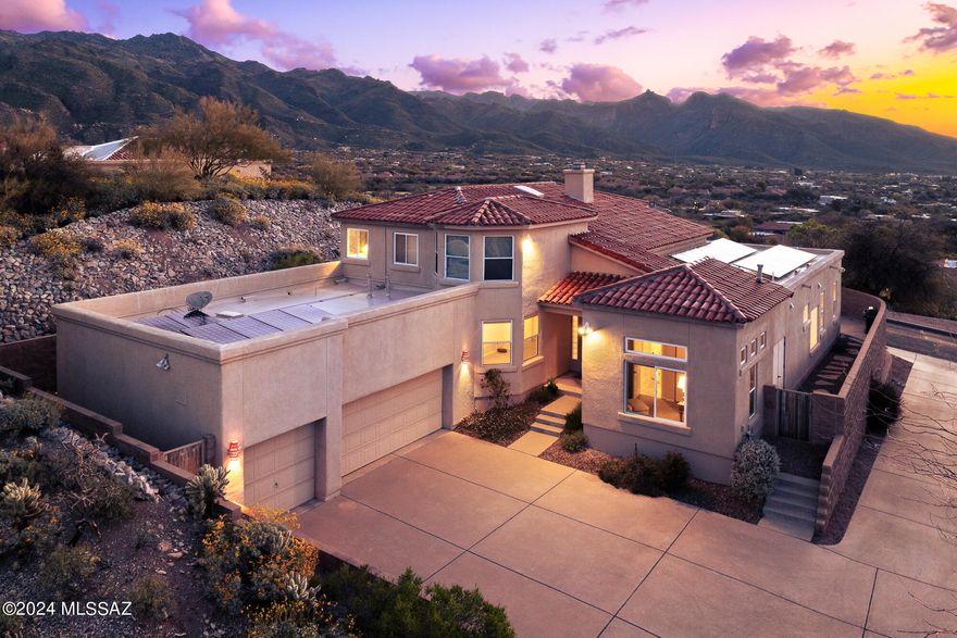 Center of the Foothills gated 5 bedroom, 4 bathroom, 3,463 Sq Ft home strategically placed on an elevated lot overlooking the Catalina Mountains and vast desert valley. Private neighborhood with only 30 homes, the Ventanas del Oeste neighborhood is close to shopping, restaurants, Sabino Canyon, and many other desirable destinations.

Multiple bedrooms, family friendly backyard, Catalina Foothills School District, and an owned solar 6.9kW max system provide approachable living in the center of the Catalina Foothills.

Vaulted ceilings and natural light, with numerous windows and mesmerizing views of the Catalina Mountains and Ventana Canyon. Main level primary bedroom and bathroom with double vanity, separate shower, soaking tub, and walk-in closet. An additional guest bedroom & bathroom on main level and three additional bedrooms, with two guest bathrooms upstairs. Kitchen is equipped with double ovens, refrigerator and closet pantry which leads to the family room with see through gas fireplace providing a seamless flow into the living room. Laundry room with washer and dryer included and 3 car garage. Enjoy the fantastic views, entertaining space, and pool from the from the backyard.

Living in the Catalina Foothills in Tucson offers a unique blend of natural beauty, outdoor activities, and urban amenities. Here are some of the best aspects:

Scenic Views: The Catalina Foothills provide stunning panoramic views of the surrounding desert landscape, including the Catalina Mountains and the city of Tucson below. The sunsets are particularly spectacular.

Outdoor Recreation: Residents enjoy easy access to hiking, biking, and exploring the Sonoran Desert. Sabino Canyon Recreation Area and Catalina State Park offer miles of trails for outdoor enthusiasts.

Upscale Living: The Catalina Foothills is known for its upscale neighborhoods, luxury homes, and gated communities. It offers a high standard of living with amenities such as top-rated schools, fine dining, and shopping.

Cultural Attractions: Tucson is a culturally rich city, with attractions such as the Arizona-Sonora Desert Museum, the University of Arizona's campus, and the Tucson Botanical Gardens. The Catalina Foothills is just a short drive away from these cultural gems.

Proximity to Urban Amenities: While the Catalina Foothills offer a serene retreat from the city, residents are still close to all the amenities of Tucson, including restaurants, entertainment venues, and medical facilities.

Sense of Community: The Catalina Foothills has a strong sense of community, with residents who take pride in their neighborhood and often participate in local events and activities.

Overall, the Catalina Foothills in Tucson offers a balanced lifestyle with access to both natural beauty and urban conveniences, making it a desirable place to live.