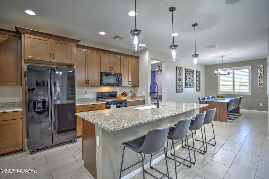 Impeccably Upgraded Mattamy Agave Model | 3BR + Flex | 2,043 Sq. Ft. of Designer-Inspired Living with Breathtaking Views. Welcome to your dream home! This Mattamy Agave model is more than just a house—it's a statement. With 3 generously sized bedrooms, 2 full baths, a flexible bonus room, and an extended dining area, this 2,043 sq. ft. stunner is overflowing with luxurious upgrades that rival any model home. From the moment you enter, you'll notice the attention to detail—custom designer paint, feature walls, and plantation shutters on every window create a space that feels both elegant and inviting. And just wait until you step outside—the backyard serves up stunning mountain views and unforgettable sunsets that will make every evening feel like a retreat.  
Highlights & Upgrades: " JellyFish Lighting System (Level 5): Programmable, permanent LED exterior lights perfect for every holiday and occasion.
" Custom Closets: Optimized storage in the primary suite and secondary bedroom.
" Enhanced Security: Upgraded front security door and side gate.
" Low-Maintenance Landscaping: Desert landscape in the front; backyard oasis with turf, pavers, and a patio ready for relaxation and sunset watching.
" Built-In Surround Sound: Indoor and outdoor entertain in style!
" Garage Goals: Epoxy floors, utility sink, and dedicated mini split system ideal for a workshop or man cave.
" Pet-Friendly Touches: Permanent dog door and snake-proof yard.
" Efficiency Upgrades: Water conditioner, tankless water heater, privacy/sun screens, and sealed tile throughout.
" Bonus Stainless Fridge: Located in the laundry room and included!

Energy-Efficient Perks:
" Assumable FHA Loan: Lock in a stellar 2.87% interest rate.

This home seamlessly blends smart tech, custom finishes, and practical upgrades with million-dollar views to create a truly one-of-a-kind living experience. Whether you're hosting, relaxing, or soaking in a fiery Arizona sunsets this home delivers.

Don't miss your chance to make it yours. Schedule your private tour today!