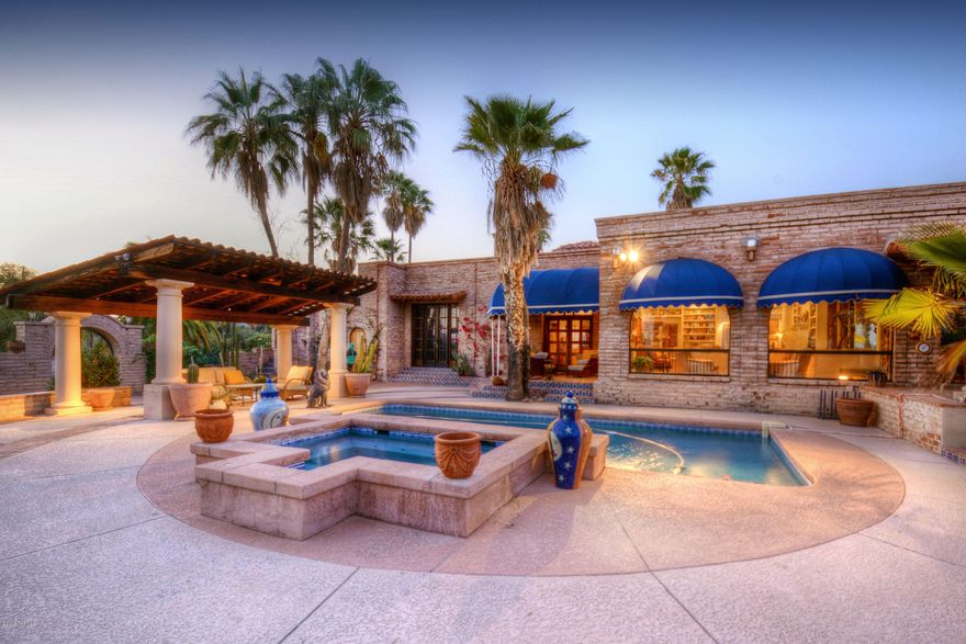 ELEGANT & GRACIOUS SPANISH COLONIAL STYLE GATED 6 ACRE  ESTATE,OVERLOOKING CITY & MT.VIEWS IN PRESTIGIOUS  CATALINA FOOTHILLS ESTATES. CUSTOM DESIGNED BY RENOWNED ARCHITECT LEWIS HALL, DRAMATIC ENTRY W/16'WOODEN MOTORIZED GATES,IRON PLATED 9FT.HIGH FOYER DOORS,HIGH BEAM CEILINGS, EXQUISITE LIVING RM W/BUILT IN BOOKCASES,WALLS OF WINDOWS,FORMAL DINING RM,FRENCH TILED KITCHEN,LOVELY BREAKFAST RM,COZY FAMILY RM W/CHARMING FIREPLACE, ARIZONA ROOM W/ARCHED WINDOWS,BEAUTIFUL  FRENCH  DRS, SALTILLO TILE FLRS,GALLERY HALLWAYS,4 BEDROOMS & 4 BATHS  IN MAIN HOUSE (6116 SQ.FT)+ 2 BD/1BATH GUEST HOUSE W/LIVING AREA(1220 SQ.FT).RESORT LIKE BKYD W/EXTENDED COV'D PATIOS,GAS HEATED POOL,SPA, FOUNTAINS,LUSH LANDSCAPING,CITY & MTN VIEWS. DIST 16 SCHOOLS.FLOOR PLAN & HOME DESCRIPTION UNDER DOCUMENTS