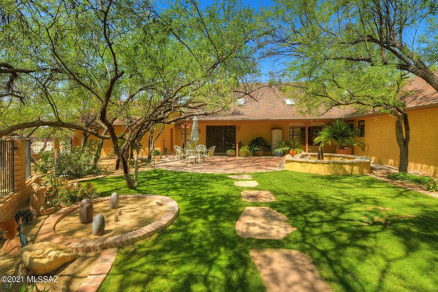Rare opportunity to own nearly 6 acres of equestrian paradise!! Privacy and nature surround you at this 3 bedroom/3 bath custom home w/split floor plan design featuring loft office w/custom built-ins, AZ room, soaring ceilings, & spacious open-concept great room. Custom designed kitchen w/granite & butcher block counters, two ovens, breakfast bar, and wine fridge. Remodeled master suite with enormous walk-in closets, wood burning fireplace, spa-like bath, and private access to back patio. Two-story guest house w/loft bedroom, full bathroom, kitchenette, & full RV hook-up. Horse facilities are top-notch w/breezeway barn, 5 indoor/outdoor stalls, 3 fenced pastures, wash rack, multiple tack & storage rooms, & direct trail and wash access. Call today for a private showing-this one won't last!!