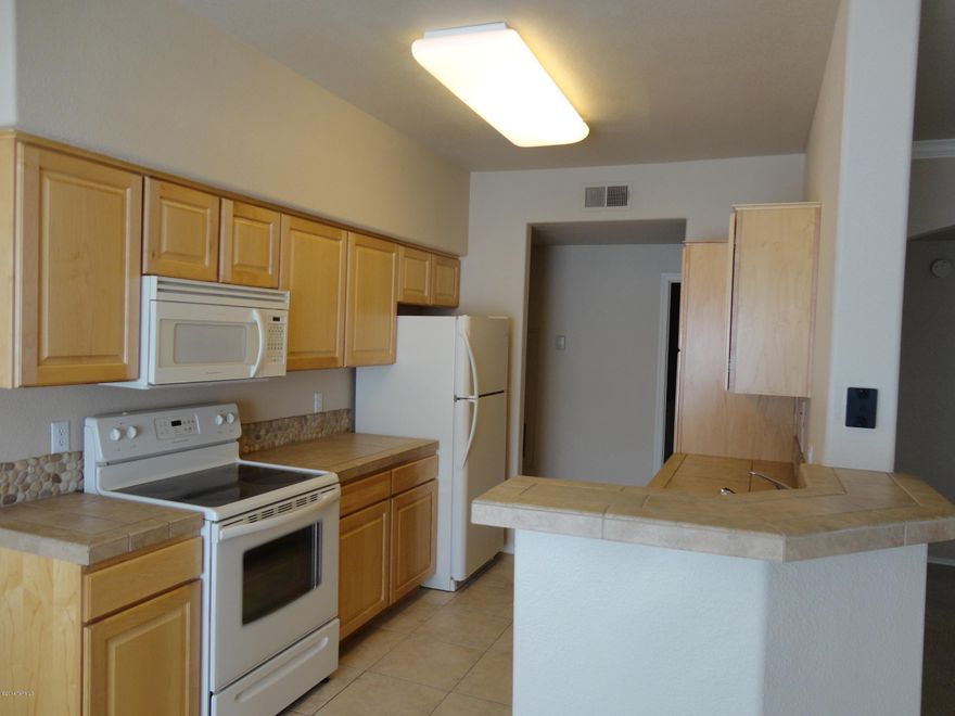 Very nice 3 bedroom/2 bath gated condo in the Foothills. 
Ground floor and an end unit in great condition. Very light and open with private patio and a fireplace in the great room. Tile counter top in kitchen w/SS appliances. Near world class resorts, Sabino Canyon for hiking and biking trails, lot of restaurants. Community includes: pool, spa, exercise room, clubhouse, BBQ areas.