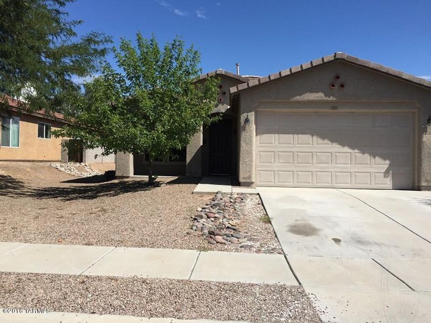 This 3 bedroom 2 bath home is ready for an immediate move in. Your home is facing west with full view of mountains and sunset, no home across the street to block your enjoyment of Tucson's beautiful sunsets! Home is located on a lot with extra space between your north side neighbor via a 10 ft. easement. Open floor plan with large great room, large tiled entry and spacious family room off your open kitchen complete with a breakfast nook and center island, executive height maple cainets with pull out shelving, black appliances. 9ft ceilings, professionally painted textured walls with rounded corners. Spacious master bedroom with ceiling fan, custom mirrored closet doors, master garden tub and shower and a sliding glass door leading to your back covered patio. Trash included.