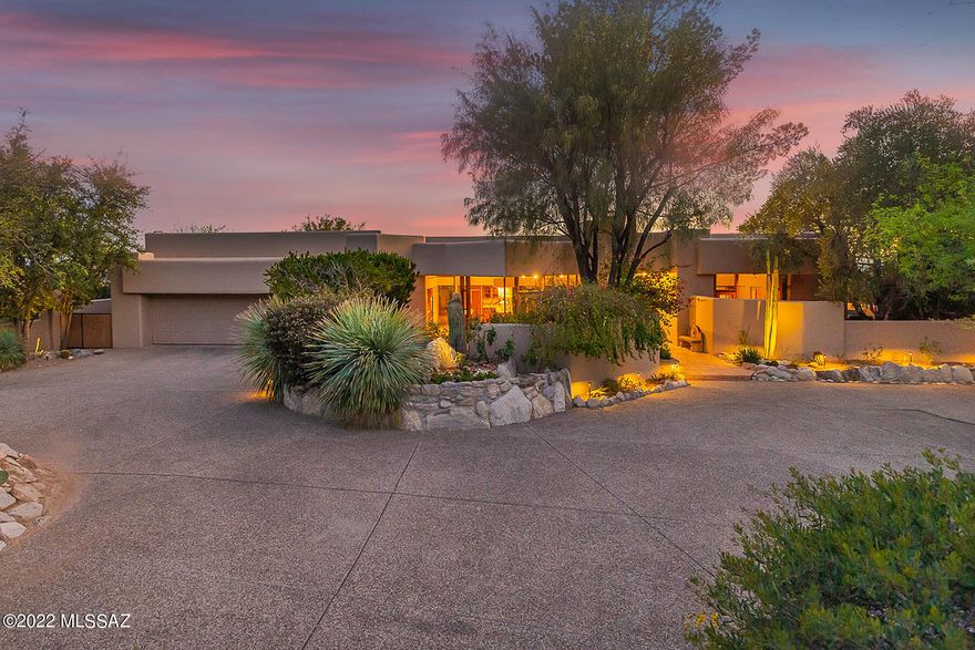 David Tyson designed desert contemporary home located in the prestigious Cobblestone Estates. A luxury guard gated private community high in the Catalina Foothills. Unique and well-designed architectural lines throughout the home. Easy flowing spit bedroom plan, light and bright 3973 sq. ft. home on 1.3 acres. Spectacular cul-de-sac elevated lot offering dramatic Santa Catalina Views and Tucson city lights. 3 bedrooms plus en-suite multi purpose room which could also act as 4th bedroom, 4 baths, great room style  kitchen, dining area and living area with spectacular views and doors opening from every room to access outdoor patios and views. Beautiful park-like outdoor living space with desert vegetation, fruit trees, charming sitting and walking areas, two gazebos, all updated LED landscape lighting. Pool, spa and spacious 3 car garage!