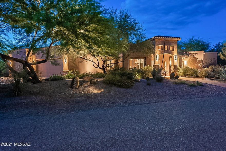 Wows upon arrival! From the moment you walk up to the grand custom glass entrance, this home pleases at every turn. Concrete floors to soaring ceilings, this splendid 3278 SQFT, 4BD, 3.5BA beckons you to enjoy its beautifully appointed kitchen w/ commercial grade range & custom vent hood, walk-in pantry, stunning master suite w/ cozy fireplace, open concept living, generous bedrooms in split floorplan. Features like double fridge/freezer, bar w/ beverage fridge, custom light fixtures, custom-built closets, soaker tub & 3 car garage add to this already impressive home. Yet it nearly pales in comparison to the exquisite resort-style living that awaits in the backyard where you can enjoy the expansive covered patio, built-in grill, spa, pool & mountain views on 0.57 acre N/S facing lot.