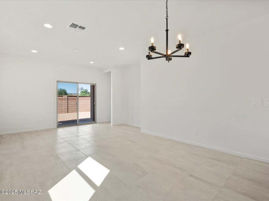 This 4-bedroom, 2-bath home offers comfort, functionality, and style. The open kitchen features a center island, perfect for casual dining or entertaining, with umber cabinets, cream/black granite countertops, and Travertine-look tile flooring paired with warm neutral carpet.

Enjoy close proximity to Davis-Monthan Air Force Base, Tucson International Airport, and The Loop Bike Trail. Community amenities include a neighborhood park and more.

Move-in ready with washer, dryer, fridge, and whole-home blinds included!