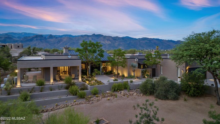 An Arizona masterpiece of modern and luxurious design on over 5 acres awaits you. Main house is approx 4000 s.f. 4 bed/3.5 bath, with an 1100 s.f. 2 bed/1 bath guest house. Gourmet kitchen with Wolf & Subzero appliances, 2 ovens, fireplace, quartz countertops and gorgeous cabinetry comes together timelessly. The sleek and comfortable living room with fireplace surrounded by picture windows brings in big views and sunsets.  The primary bedroom boasts amazing views w/a third fireplace and an enormous en suite bathroom with a walk-in cedar closet and more.  There's a separate heated/cooled studio surrounded by glass walls just off of the main bedroom - an inspiring area for an art studio, home office or exercise room. The spacious guest house comes furnished.