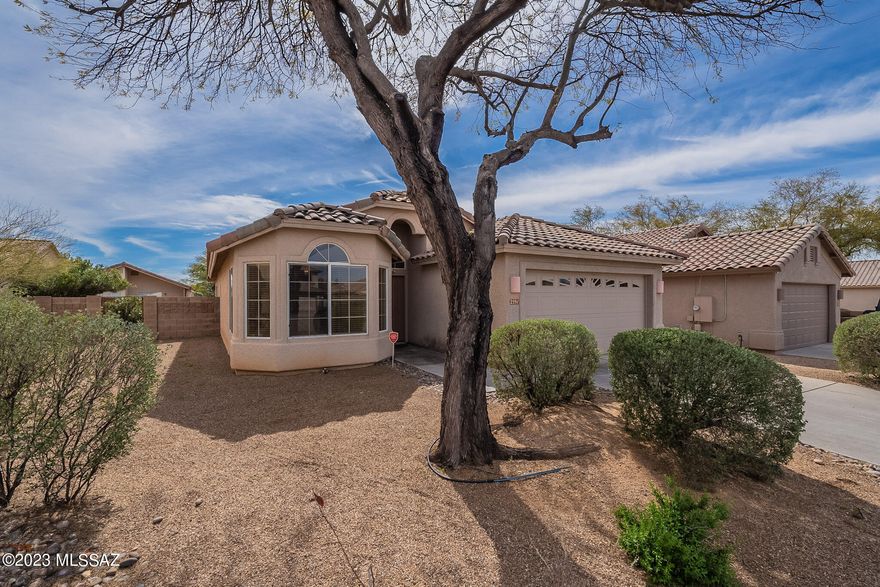 New Solar System less than a year old. This gorgeous home is situated on a quiet cul-de-sac in a mature neighborhood. near golf course, lighted sidewalks and beautiful surroundings Tile throughout, toasty fireplace, open floor plan with a professionally landscaped cactus island in the back yard, covered patio with block wall. This 3 bed 2 bath home with fireplace is a must see!