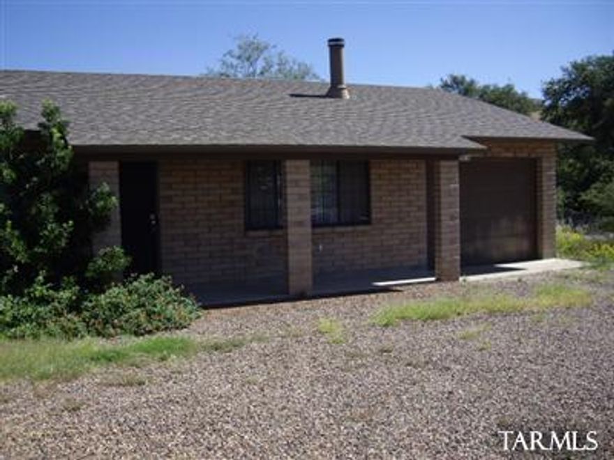 Spacious 3 bedroom home with garage, fireplace, washer , dryer, fenced yard and custom kitchen, breakfast bar indoor laundry, new carpet and covered patio.