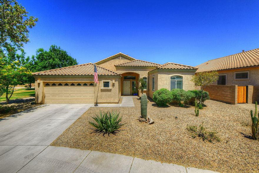 Beautiful home on a great lot! Tons of upgrades including brand new A/C, newer kitchen appliances, plantation shutters, and fresh paint to name a few. The backyard backs up to desert preserve and features an oversized covered patio! Enjoy lemon, grapefruit, pomegranate, fig, orange, apples and grapes from your own yard! Open floor plan with split bedrooms, 10' tall ceilings. Home borders park! Absolute must see!