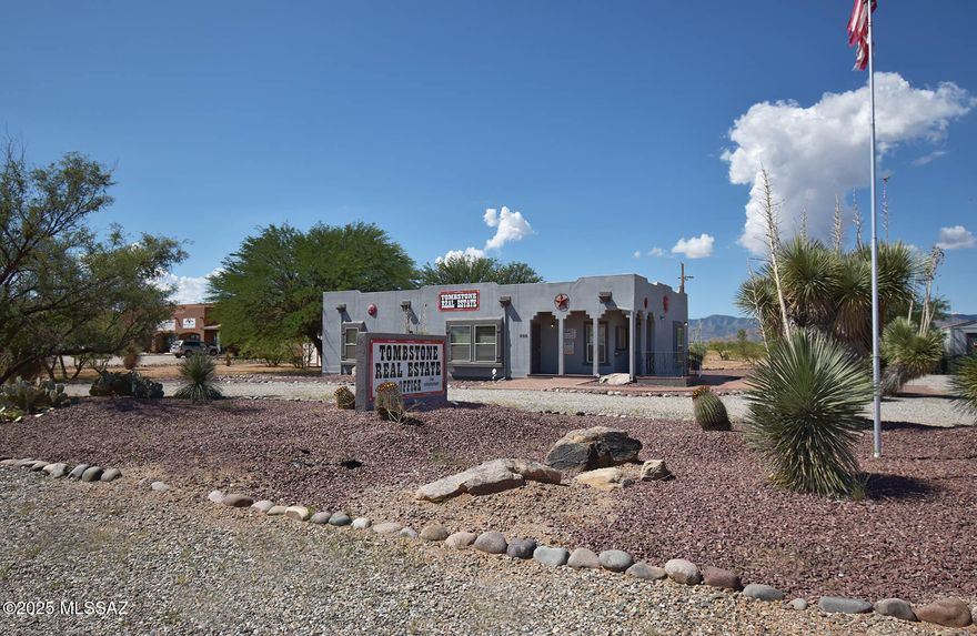 Custom-built Santa Fe style modular office building on 1.11 acres with 1,530 sf of versatile space; formerly a real estate office but easily adapted for business or single-family use. Located on a corner lot along Frontage Rd just off Hwy 191, this property offers high visibility and growth potential, especially with the planned Port of Entry in Douglas expected to boost traffic and investment in the area. Bright open reception area with abundant windows, break room, two private offices with storage, plus a spacious conference room/office. Large back porch has outstanding views of the Dragoon Mountains. Big one-plus acre lot gives you lots of space to work with. Matching storage shed included. Strong location, solid construction, and unlimited possibilities.