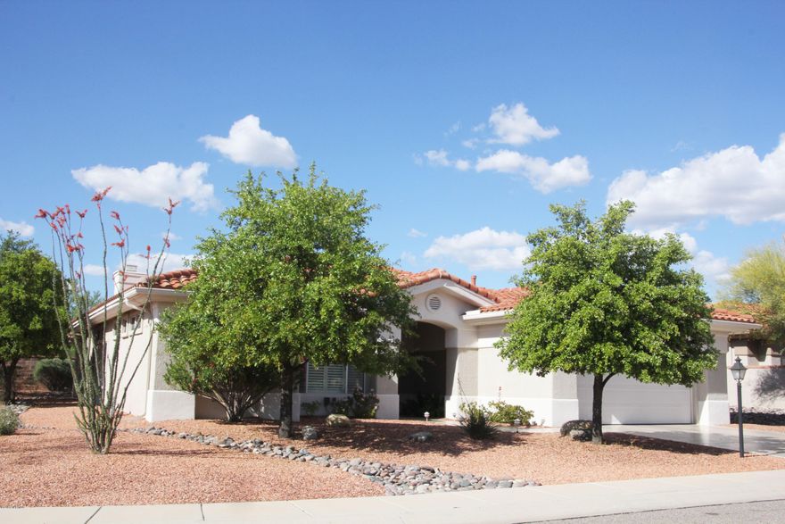 Beautifully upgraded Mountain View plan w/2 BRs,den,2.5BAs on 11,800 SF lot w/lots of privacy, view & large common area to West. Shutters throughout, 20 inch tile in kitchen, baths, family room, den & hallways. Newer neutral carpet in liv/din & bedrooms.Kitchen has new cabinets, granite counters, all appliances under warranty into 2017. Gas log fireplace in family room. Master suite has custom closet, upgraded bath w/executive height counters. Guest suite has custom closet, wall bed & flat screen TV incl. Newer HVAC, water heater 2012, aluminum ramada, water feature & much more to see! Move right in!