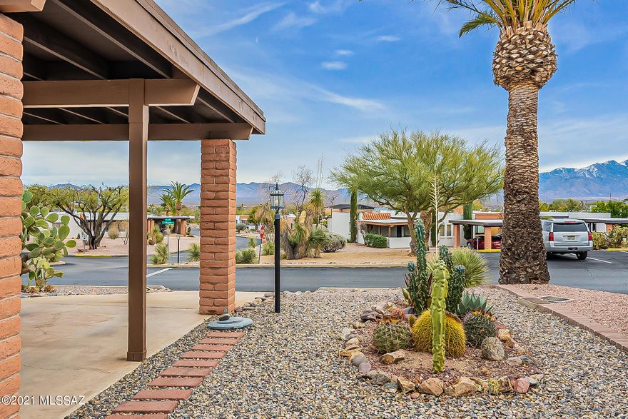 Pride of ownership definitely shows in this end unit townhome. Newer HVAC, water heater, windows and kitchen. It's an easy move with furniture included. An Arizona room looks out onto a private rear patio with thriving citrus trees. The front east-facing courtyard provides an excellent mountain view. The sweeping views continue as you enter the great room with windows on three sides. From this elevated corner lot take a quick walk down to the neighborhood pool/clubhouse, part of GV Rec, or west one street to a walking trail.