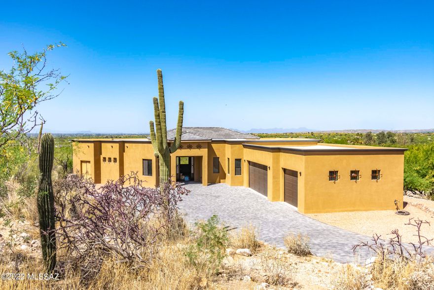 THIS IS IT! New Construction. It simply doesn't get any better. Dyed, scored concrete floors throughout, solid concrete block construction with stucco finish, 360 views, private location at the end of a Cul de Sac, overlooking Agua Caliente, the best park in Tucson. This is on the national register of historic places. Gorgeous, custom kitchen, amazing Primary suite with glassed in wet room, 2 additional Primary suites, large 3 car garage, views from every window in the home, $15,000 custom 9ft by 4ft Wrought Iron Entry Door, upgrade after upgrade. This is the best home I've seen in 40 years of living in Tucson. 15 minute drive to Tanque Verde falls, 5 minutes from 49er golf course, 50 minutes from MT. Lemmon Ski Resort, 35 minutes to Rose Canyon Lake stocked with rainbow trout, 10 minutes to Tanque Verde Ranch's 4 star resort with restaurant and horseback riding.