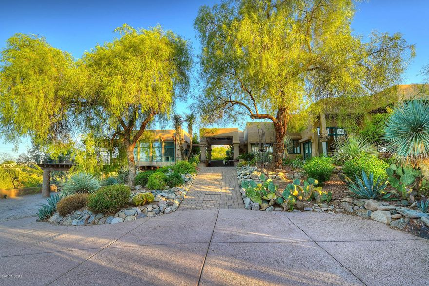 Private, resort style living in the Catalina Foothills. Open floor plan with top of the line,architecturally designed features throughout. Fantastic views of the city, mountains, and sunset. Beautiful deck with pebble-tech pool and spa. Lengthy covered patios that capture the city and mountain views, and are perfect for year-round entertaining in the Sonoran desert sunshine. Chef worthy open kitchen with stainless steel, Viking appliances. Full, 1 bedroom guest house is perfect for guests, yoga, pilates, or office. Plenty of parking in the 3 car garage and 3 additional covered parking spaces. District 16 schools. Don't miss out on this special home!