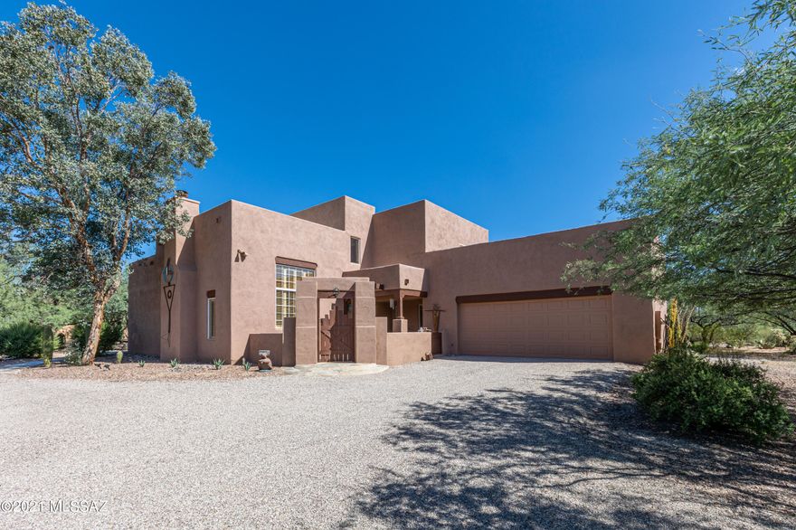 Artist Retreat located in the Tanque Verde Valley. Rustic Charm awaits you. Breathtaking views in every direction.  This home has been professionally updated, Fresh paint exterior, interior. Front courtyard , Living Room with cozy fireplace, formal dining room, soaring ceilings. Kitchen boasts granite counters two dishwashers, wood beamed ceiling. Family room has built in bookcases and french doors leading to outside courtyard   Bonus room with flagstone flooring & beehive f/p.  Secondary bdrm downstairs with bath nearby. New Flooring upstairs, Primary suite with fireplace & outdoor deck, Primary suite bath with large jetted tub. Separate Art studio/den/office with private entrance and bath with large windows. Bedroom upstairs with entrance to oversized deck framing the mountains.
