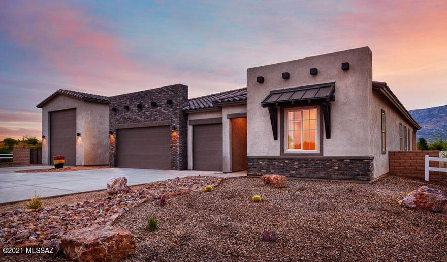 This ranch-style model home greets guests with a 3-car garage and inviting covered entry. Inside, you'll find airy 10' ceilings, 6'' x 48'' wood-look ceramic tile flooring and a great room with multi-slide doors leading onto a covered patio. You'll also appreciate a gourmet kitchen featuring quartz countertops, a center island, a walk-in pantry and matte black appliances. Other highlights include a central laundry, a lavish owner's suite with a tray ceiling, private retreat, walk-in closet and deluxe bath with barn door and walk-in rain shower, and a club room. A quiet study with French doors and a built-in bookcase and two secondary bedrooms with a shared bath complete the impressive home. Includes additional windows and a cabana with fireplace! Also included: a detached 50' RV garage!