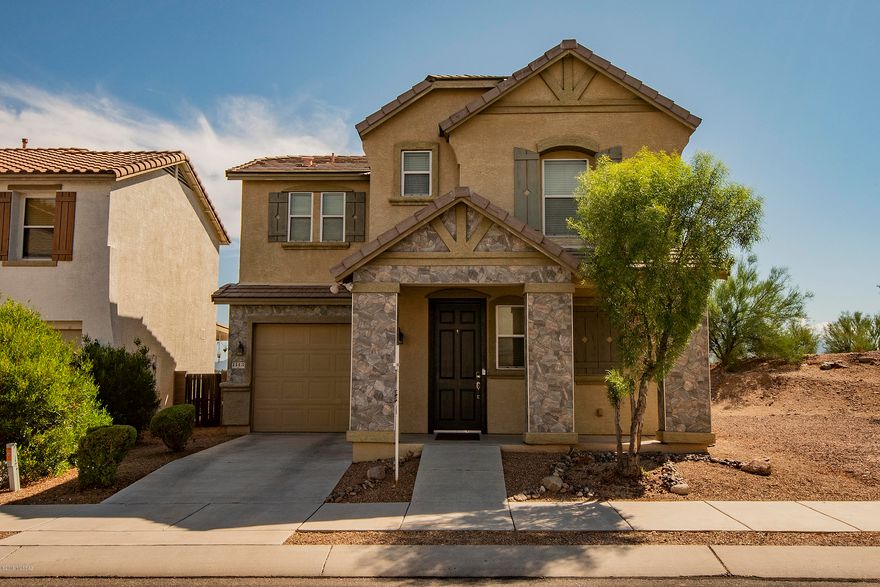Striking  two-story home with open floor plan situated in the – Pantano Overlook community.  A turn-key 3bed/3bath home, seller purchased directly from the builder, Pride of Ownership is immediately evident.  Guests are welcomed by a stack stone entry with custom designer paint.  Property appointments include ceiling fans throughout, downstairs bath for guests with spacious kitchen equipped with gorgeous views courtesy of this Premium Lot.  Covered back patio with brick pavers, chic back yard and ''Green'' landscaping make this backyard with endless views a true entertainer's delight.