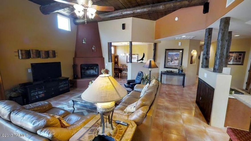 All communication and negotiation shall be conducted only through the Owner/Seller. Owner is
licensed to sell real estate in Arizona. Immaculate 3BR/2BA great room plan in small enclave of TJ Bednar homes. Backyard has covered patio,
extended pavered area, built-in BBQ, Kiva fireplace and views of those spectacular Catalina Mountains. Spacious kitchen has new silestone counters, 42in cabinets, SS appliances. Split bedrooms too -- master on one side and 2 more bedrooms plus a full bath on the other. Roomy 2-car garage equipped w/cabinets for storage.