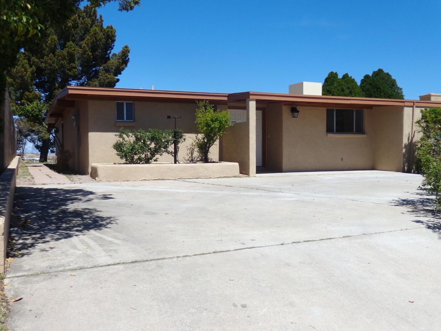 This charming newly remodeled  5/BR  6/BA home may easily be converted into a  6/BR home. Featuring a beautiful kitchen with granite counter tops, a stainless steel stove with a brick oven, perfect for baking pizza's. Dark colored cabinetry. Natural colored tile through out the whole house. A huge stone fire place located in the living room area, giving it a warm welcoming feeling.  Each bathroom features earth tone colored tile, walk-in showers,vessel bowel sinks and beautiful light fixtures.  Walk outside to a spacious enclosed tiled patio.  It's truly a unique home.