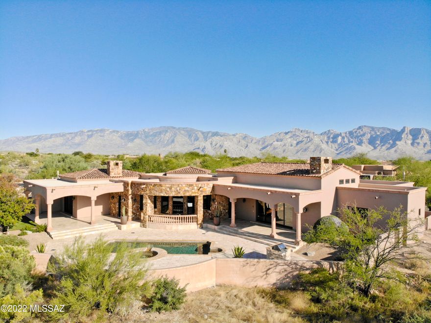 Nestled in the prestigious gated, Top 100 golf community of Stone Canyon is this GORGEOUS Mediterranean inspired custom residence! The just renovated primary suite includes ultra-luxury touches that rival any resort spa, including a bookmatched granite slab steam shower, towel warmer, and 104'' Kohler infinity edge tub! The bedroom showcases pocketed motorized blackout drapes, inset coved ceiling, and extensive kitchenette, while an adjoining exercise room rounds out the owner's suite. The rest of the home offers equally impressive details like a commercial Viking range, temperature controlled wine cellar, open great room w/soaring ceilings, Sonos sound system, coffered ceiling dining room, grand living room, stunning Tortolita Mountain views, refreshing pool/spa, and travertine floors.