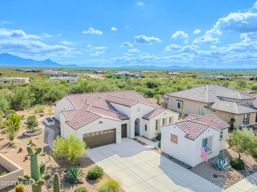 Location, Location! Nestled in the breathtaking surroundings of Santa Rita Mountains & in close proximity to the renowned Madera Canyon, this property offers an unparalleled opportunity to embrace the beauty of Southern Arizona's landscape. Step inside, & you'll be greeted by a modern oasis with gorgeous Santa Rita mountain views from the main living areas. High-end features throughout the home include tile flooring, quartz countertops, custom lighting, custom ceiling fans, & beautifully crafted cabinets, creating an atmosphere of luxury & sophistication. The open-concept design allows for a seamless flow between the spaces. The kitchen is a chef's dream, with a gas cooktop, kitchen island, and a gas fireplace in the Great room. A Butler's pantry adds an extra touch of elegance and functionality to this culinary haven. The property also boasts a large laundry room with ample storage and a utility sink, making daily tasks a breeze. The primary suite is truly fabulous, and the split bedroom floor plan offers privacy and comfort for both homeowners and guests. Take a stroll along the paver sidewalk that graces the north side of the house, allowing for a leisurely and scenic exploration of the property. The 2.5 golf cart garage is epoxy-coated and includes hot water recirculation and a soft water system, ensuring convenience and comfort. With an open back yard that extends to a desert arroyo, you'll have the perfect vantage point to observe the diverse wildlife in the area. The property also features a guest house casita, providing an ideal retreat for guests or extended family. Reap the benefits of generating your electricity from sunlight. With the solar owned system, you can significantly reduce your electricity bills. This property is more than just a home; it's a lifestyle. Enjoy the tranquility of the desert landscape, the convenience of high-end features, and the warmth of a welcoming community. Don't miss the chance to make this extraordinary property your own.
