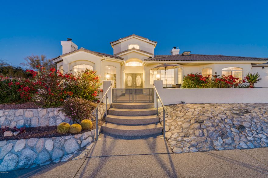 Magnificent custom-built home strategically perched on a premium lot to savor the spectacular city & mountain views. High on the ridge & on a cul-de-sac for stunning privacy. Enjoy abundant natural light & desert beauty from every window. Dramatic foyer welcomes w/ soaring ceilings, cozy family room & stone fireplace. Casually elegant floor plan w/ formal living & dining room ideal for entertaining. Well-appointed kitchen w/ ample cabinets/counter space & inviting breakfast nook. Home is meticulously maintained w/ engineered hardwood flooring, freshly painted interior, high quality designer finishes throughout, speaker system & recessed lights. Fabulous outdoor living space w/ extended covered patio, new Hot Tub, built-in BBQ & water features. Your own private oasis is ready for you!