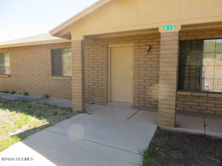 Lots of room around this delightful home. Inside enjoy the polished concrete floors, Living rm + Family room with fireplace. Spacious kitchen with island, master bedrm with ceiling fan with lights, air conditioned & a large garage with cabinets. Large yard & huge covered rear porch great for family, pets, entertaining and has a garden area, beautiful vegetation & views. Home sits back from road & has chain link fencing. Adjoining Lot 71 is available for sale.