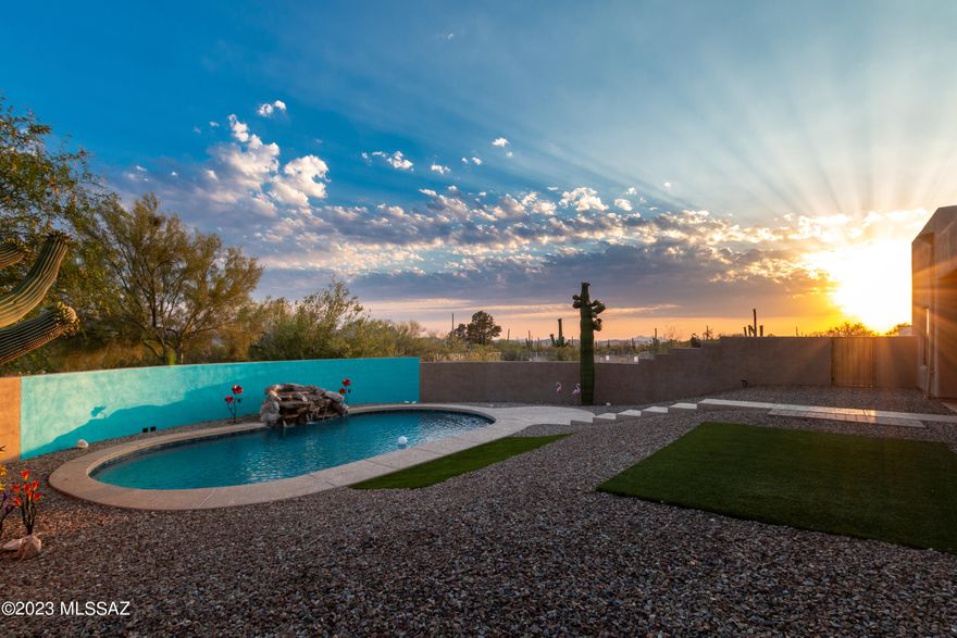 Welcome home to your scenic desert Oasis! You will love to escape to your very
own private sanctuary nestled on 3.3 acres of picturesque land in the heart of the northwest. This exquisite 4 bedroom, 3 bath home offers a tranquil retreat where luxury, space, and natural beauty harmonize seamlessly. With a sparkling pool, rock waterfall, expansive grounds, and thoughtful designed living spaces, this property is a true haven for those seeking the perfect blend of comfort and serenity. Step inside the welcoming courtyard to be greeted by the interior of the home that has an open and airy ambiance that flows throughout. The spacious living room invites you to unwind by the cozy fireplace, while large windows display stunning views of the mountains and surrounding landscape, embracing the
essence of desert living. The chef-inspired kitchen is a culinary delight, featuring granite countertops, tile backsplash, ample cabinetry, generous pantry, and a breakfast bar for casual dining. This kitchen is equipped to satisfy the needs of any home cook or entertainer. Adjacent to the kitchen, an elegant dining area sets the stage for unforgettable gatherings with family and friends.
The primary suite is a true refuge, offering a peaceful place to relax and rejuvenate. Wake up to awe-inspiring views through the large picture windows and step out onto the private patio for morning coffee. The en-suite bathroom boasts a luxurious soaking tub, a walk-in shower, spacious closet, and dual vanities, providing a spa-like experience. Three additional well-appointed bedrooms provide ample space for family members or guests, with each room boasting its own unique charm and comfort. The
three bathrooms are stylishly designed and offer modern fixtures and finishes. The additional outdoor space is a paradise unto itself. Lounge by the sparkling pool with cascading rock waterfall, take a refreshing dip on warm summer days, or simply soak up the sun while relishing the peacefulness of your surroundings. The expensive 3.3-acre lot allows for endless possibilities, whether you envision creating a lush garden, a play area for children, or a private retreat to reconnect with nature. This home will offer
you the perfect blend of tranquility and convenience. Enjoy the serene desert landscape while still being within easy reach of the amenities, including shopping, dining, and entertainment options. Additionally, outdoor enthusiasts will appreciate the proximity to hiking and biking trails, providing opportunities to
explore the beauty of the surrounding nature. Do not miss your chance to own this exceptional property, where comfort, luxury, and nature intertwine seamlessly. Schedule your private showing today and start envisioning the idyllic lifestyle that awaits you in this remarkable property.