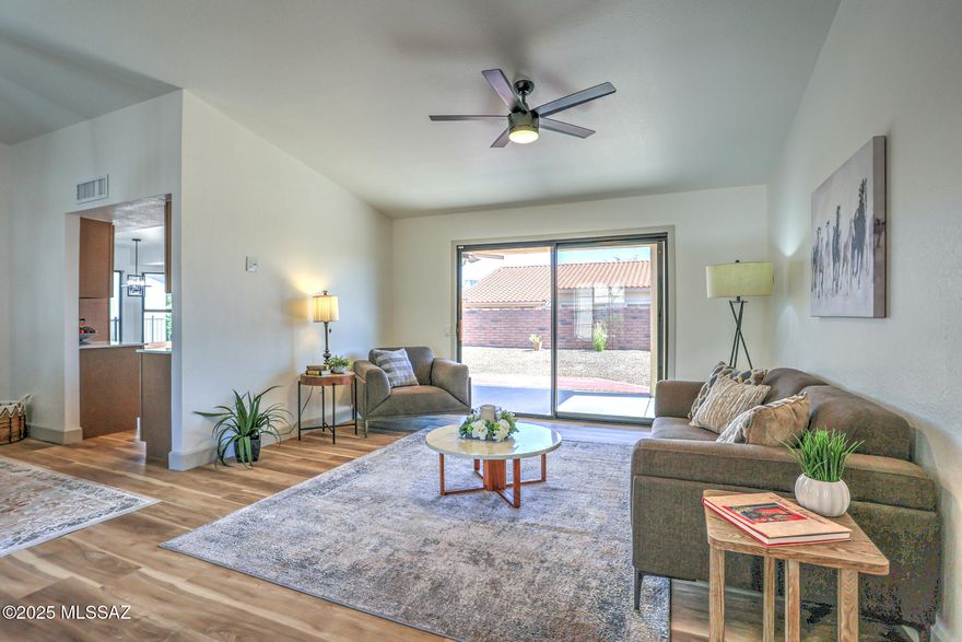 Seller will accept or counter offers in the range of $399,900-$414,900 .  Seller will pay off or remove solar.  Welcome to Sun City Oro Valley, a 55+ active adult community!  You won't need to lift a finger in this home, just move right in, everything is already done!  Remodeled to perfection in sleek modern style with new kitchen and baths, new LVP flooring, baseboards, doors and trim throughout.  Gorgeous finishes with upgraded wood cabinetry, quartz countertops and LVP flooring throughout (no carpet).   All electrical trim updated, fresh interior and exterior paint and new flat roof with warranty.  Large fully fenced yard with mature plantings  on auto irrigation enjoy the outdoors on front and back covered patios.  Garage finished with epoxy coating for continued easy care for years! Tour the community amenities with multiple clubhouse complexes, a large selection of clubs to join, 2 pools, spa, pickleball and tennis courts, exercise facilities and The Views Golf Course and restaurant complex! Live the life, meet your neighbors and welcome to Arizona!