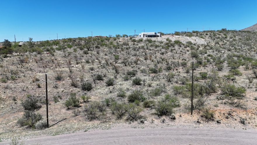 Rural residential lot on a hillside.