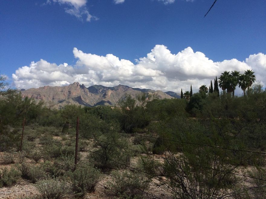Located in the original Catalina Foothills Estates. Build the custom home of your dreams on this prime, nearly level, easy build 1.3 acre site with wonderful mountain views, close to La Encantada’s restaurants and shopping. Opportunity to build in a neighborhood of luxury homes on large one to five acre parcels in Catalina Foothills School District, 5 minutes from St Phillips Plaza, and 20 minutes to the UofA. The ingress could be on Camino Miraval.  Please call owner/agent to walk one of the best priced lots in all of Dist.#16. Note: Gas/electricity/phone now on property.