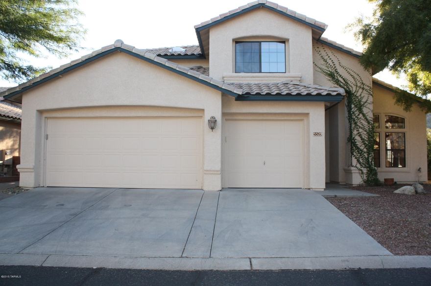 Gorgeous 4BD/3BA home located in the Catalina Foothills.  Terrific and sought after floor plan features open kitchen/family room, 1BD and 1 full bath downstairs, laundry room with washer/dryer included, laminate flooring, living & dining room.  Large master suite upstairs with a private patio, walk-in closet, garden tub and separate shower, duel sinks. Beautiful gated pool, views and privacy in the backyard.  Three car garage.   This is a must see!  District 16 schools.