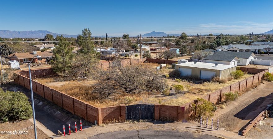 An amazing opportunity to own a 0.5 acre lot in the middle of town to build your dream home. The lot has electricity on site, its own private well with a 6000 gal water tank, and a 1,200 sqft garage/workshop. Sewer and city water connection are at the property line. The whole lot is surrounded by a brick wall and has two gates for access.
Property is sold as is.