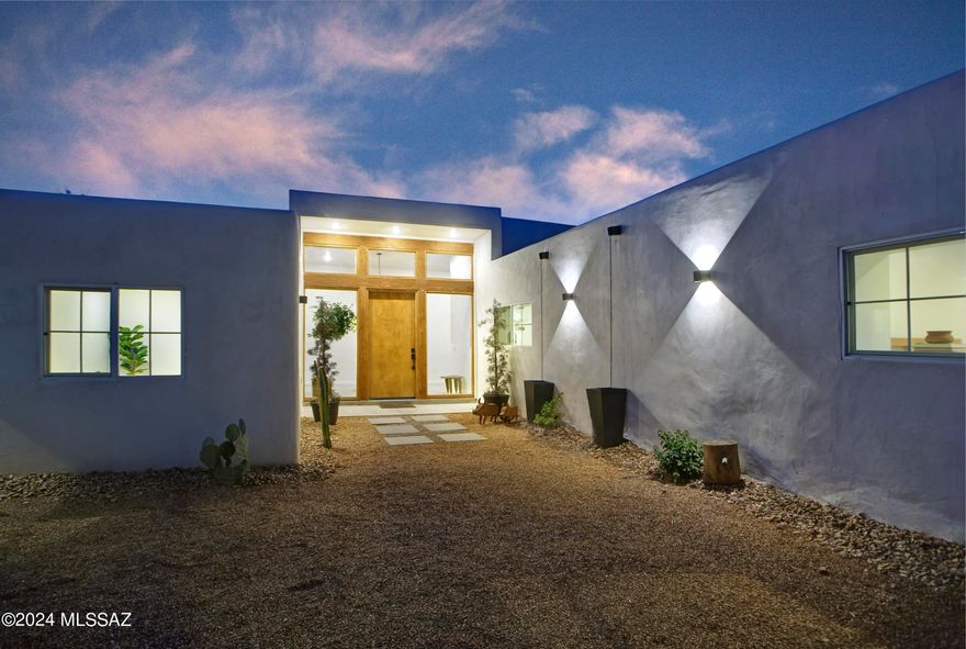 A creative expression blending historical elements, mid-century style and modern features creating a one-of-a-kind property in the heart of Tucson. The original 1947 mud adobe structure and combination of rural & urban provided inspiration for a dynamic architectural team to expand (nearly doubling the space) and reimagine this home. Carefully curated, the design honors the desert, while offering a fresh look & layout that suits today's lifestyle. Starting with the arrival through a beautiful casement entry door leading to a dramatic entry, everything here is custom and intentional. Form meets function with an open living space and split floor plan that provides 3 bedrooms, 2 ½ bathrooms and a pocket office, spanning 2278 sq ft. The materials and design elements are simple, yet elegant. Light filled spaces are dotted with custom millwork, solid wood beams, perfectly positioned skylights, and carefully placed windows that draw the eye to green outside. Made to live and last, you will find large format tile and engineered hardwood on the floors, quartz counters, and soft close cabinetry. Sustainability was also top of mind in maintaining the adobe & masonry walls, adding insulation, installing electric appliances and selecting a light exterior for reflective qualities.

There is an artistic and indigenous feeling in the historic neighborhood. Years ago, RillitoBend was home to the famous painters Maynard Dixion, Ted De Grazia and other creative spirits. Situated along the Rillito River, mature trees and community gardens are scattered throughout. Founded in 2010, 44 acres of open space with abundant plants and wildlife are available to enjoy at the Rio Vista Natural Resource Park.

Although this property feels tucked away, everything the city has to offer is at your fingertips. Immediate access to Bicycle Boulevard provides the opportunity to ride to work or amenities. Within a ½ mile, residents enjoy the Rio Vista Park, the Tucson Raquet Club & access to The Loop along the Rillito River, which makes a variety of shops, restaurants and farmer's markets available by way of bike or foot. Directly south, the Winterhaven festival of lights is walkable every holiday season, while the University of Arizona is less than 4 miles away.

This relaxed and community-oriented setting would make a wonderful full-time home or seasonal residence. With no HOA or deed restrictions, it would also be well positioned as a short-term rental.