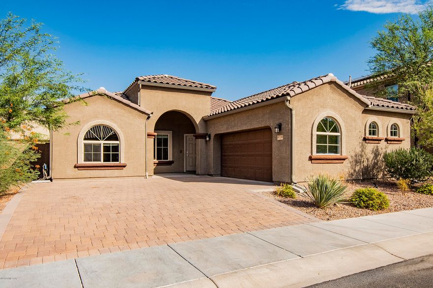 This exquisite one story 4 bedroom Kramden model in highly desirable Saguaro Bloom community has been upgraded with ceramic wood-look tile throughout. The wide-open floor plan and soaring ceilings give this home an open, airy feel. Shows like a new home with fresh paint and upgrades galore, alarm system, water softener, r/o unit in the kitchen, and even a Ring doorbell and Honeywell Smart Home Thermostat. The back yard features artificial grass to minimize your water bills and eliminate the upkeep. It's impossible to find a single story 4 bedroom home with den/office/bonus room in such pristine condition anywhere else in the NW at this modest price.