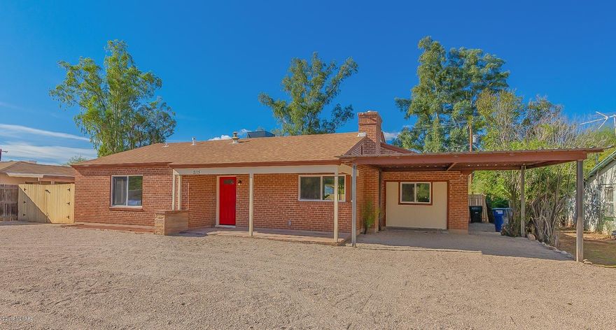 Seller will accept or counter offers from 349900-354900. Beautifully remodeled 3bed/2bath ranch style home available in the heart of Tucson. Excellent central location, just a short walk or bike ride to cafes, museums, popular shopping, restaurants and nightlife and just 2 miles from the UofA. Inside is immaculate, with tasteful finishes from wall to wall. Spacious open floorplan features exposed wood beam ceilings in the living and dining areas, a charming fireplace, wood look tile flooring in all high traffic areas and soft plush carpet in the bedrooms. Modern kitchen boasts crisp white cabinetry and an island with breakfast bar seating. Master bedroom includes a private ensuite with dual sinks and a walk in shower.