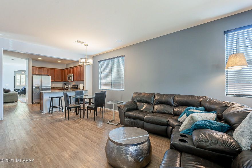 Ready to move in, close to everything! Nestled in the back of the neighborhood, this lovely 3bed+Den home will be perfect for you. With sleek and modern high quality laminate throughout the house for easy maintenance, stainless appliances, and a gas fireplace for cozy evenings. The split floorplan is perfect for today's living, along with a dedicated den/office for your work-at-home needs.