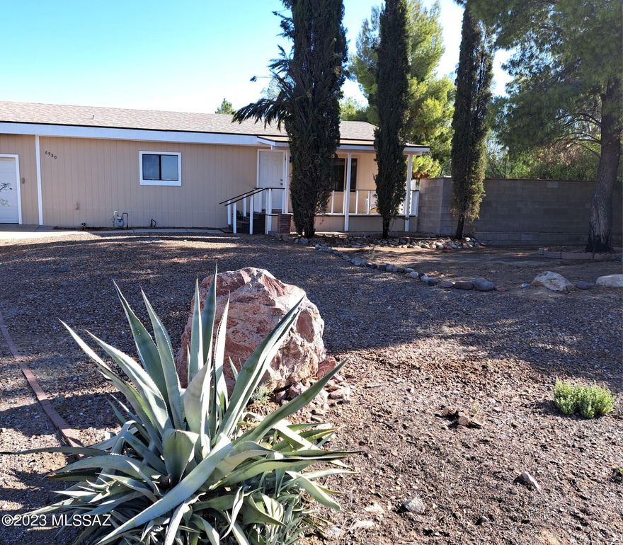 This updated 2 bedroom 2 bath home sits on just under a half an acre!  Huge great room with beautiful views.  Bedrooms have new carpet.  New wood laminate.  Huge kitchen with a large island. Plenty of storage. Truly a great place to entertain.  The additional room can be used as an office or den and has built in storage.  Covered patio in the front and a patio in the back off of the kitchen as well.  Part of the fence is brick and the rest is chain link.  The attached 2 car garage has 2 storage closets with built in shelves and one has the water heater.  The workshop is huge!  This is a must see home and is in pristine condition.  No HOA!!