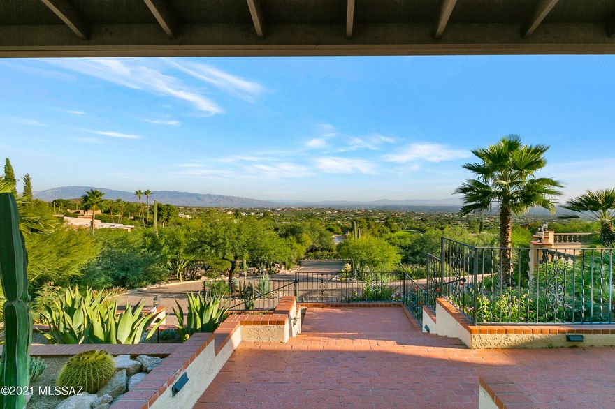Spectacular city and mountain views perched high above Tucson in coveted Skyline Country Club Estates. Just over 5000 square foot main residence with four bedrooms and four bathrooms, plus separate guest residence with one bedroom, one bathroom, kitchenette, sitting room, plus its own laundry area. Both recently, thoughtfully renovated. Main residence with wonderfully updated kitchen highlighted by white, dove tailed/soft close cabinetry, luxurious granite countertops, huge island with additional cabinetry, built-in Thermador refrigerator, four burner gas cook-top with griddle, double ovens, farm sink and vent hood with cabinetry face. Huge master suite boasts sitting room with fireplace, large bedroom space with sliding glass door to private patio with spectacular city views to the South plus large picture window with wonderful mountain views to the North. His & her walk-in closets with built-ins, separate soaking tub and large walk-in shower. Beyond the master bath is a large space perfect for an exercise/yoga room, also with copious light and mountain views. Home boasts high ceilings throughout, separate living room, formal dining room, large breakfast area with built-in cabinets, plus large additional room with wet bar over looking the pool/spa and fabulous views. Guest residence can serve many purposes.
