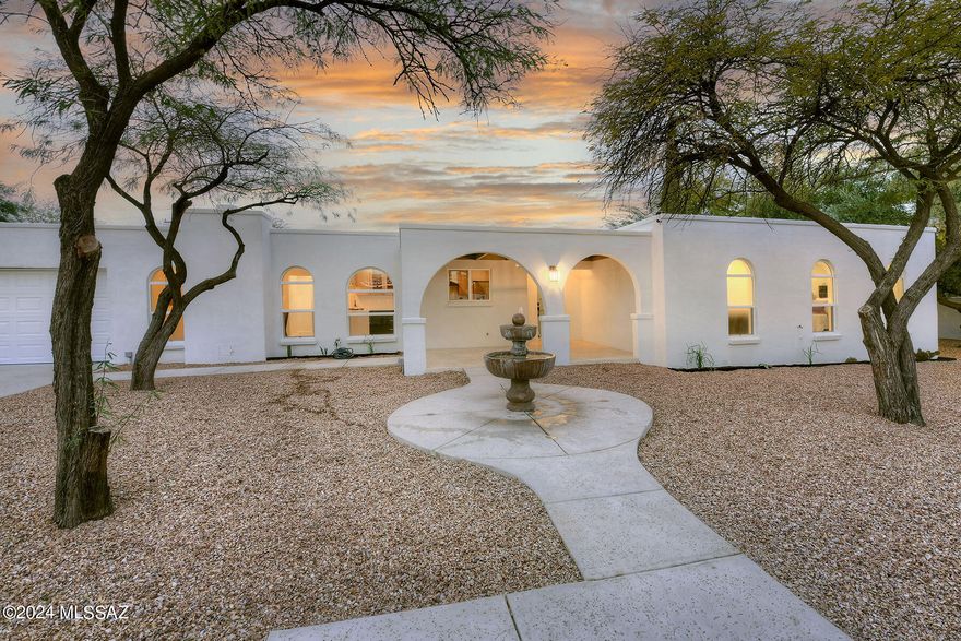 Sam Hughes Southwest Contemporary, built in 1975, located near the bike/walking path to the University of Arizona.  Beautifully & impeccably renovated, 4 bedroom & 2.5 bathroom home.  Blonde plank wood flooring throughout living areas. new & ample kitchen cabinetry has tons of storage, quartz counter tops, in this great cook's kitchen, new fixtures & hardware, stainless steel appliances, tiled back splash and includes an eat-in area.  New dual pane windows throughout! New light fixtures throughout. Dining area, sunken living room, French doors to a covered back patio.  Walled and private, large mesquite trees, off street parking, 1 car garage with finished floors, plus electronic gate. walk to Himmel Park, Flora's market and more! Owner is a licensed Realtor in the state of Arizona.