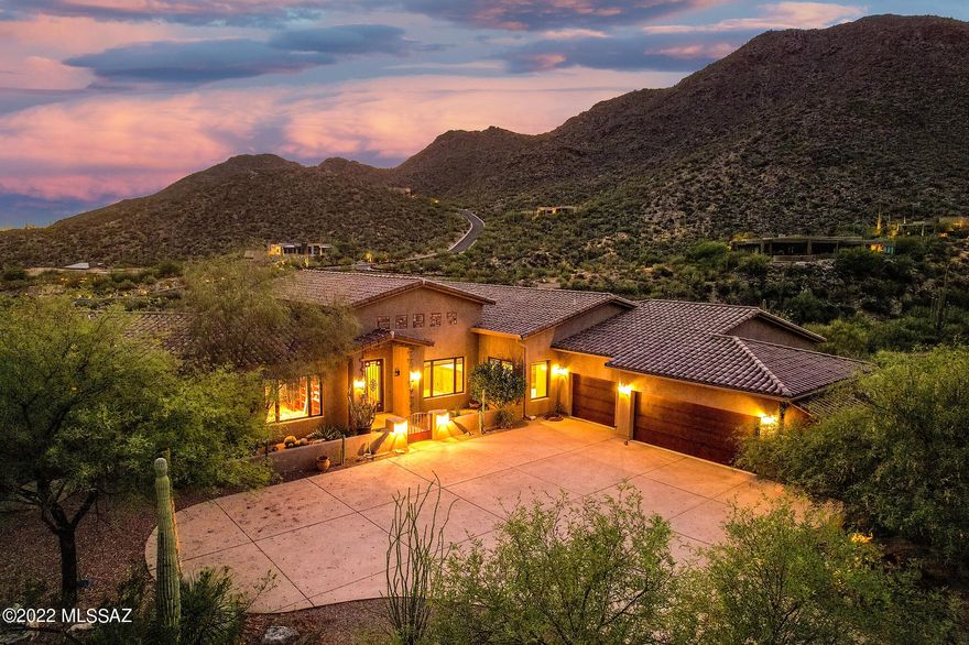 THIS 5,143 SQ. FT. LUXURIOUS EXECUTIVE SPECTACULAR HOME, ON PREMIUM 2 ACRE LOT, IS LOCATED IN THE SOUGHT AFTER EXCLUSIVE COMMUNITY OF CANYON PASS, WITH MANNED SECURITY ENTRANCE!  THIS MASTERFULLY LAID OUT HOME IS FOR THE DISCERNING & ASTUTE BUYER THAT DESIRES PRIVACY & SWEEPING PANORAMIC PRISTINE MOUNTAIN VIEWS. THE WORLD RENOWNED GALLERY GOLF & SPORTS CLUB AND THE RITZ CARLTON RESORT ARE ONLY MINUTES AWAY! THIS HOME IS NOT A DIAMOND IN THE ROUGH IT IS ''A REAL DIAMOND''

THE ENTRYWAY IS MASSIVE AND LEADS INTO THE LARGE AND COZY LIVING ROOM, FEATURING A ROMANTIC FIREPLACE, BUILT IN BAR, AND SPECTACULAR VIEWS. 
THE CHEF'S KITCHEN OFFERS GAGGENAU DOUBLE OVENS W/ WARMING DRAWER, VIKING RANGE, VIKING REFRIG/FREEZER, 2 DISHWASHERS, MAIN & PREP SINKS, GRANITE CNTRS, ALDER CABINETS, & LARGE PA THERE IS A SPACIOUS DINING ROOM WITH AN ADDITIONAL DINING AREA IN THE KITCHEN. 

MASTER BEDROOM INCLUDES A FIREPLACE, HIS & HER'S WALK IN CLOSETS. MASTER BATHROOM FEATURES TUB & SHOWER WITH A FIREPLACE! THE OTHER THREE BEDROOMS AND BATHS - YOU WILL HAVE TO SEE TO BELIEVE HOW WELL LAID OUT THEY ARE! A LOGICALLY LOCATED CLEAN UP ROOM WITH SHOWER IS CONVENIENTLY LOCATED NEXT TO THE 5 CAR GARAGE WITH WORK PLACE WITH SINK.

THE EXECUTIVE OFFICE HAS FULL CUSTOM WOOD SHELVING.
LARGE LAUNDRY ROOM! 
EXQUISITE WOODWORK THROUGHOUT THE HOME.
 AMAZINGLY CUSTOM DESIGNED POOL, JACUZZI, OUTSIDE FIREPLACE AND BEAUTIFUL FIRE PIT. 
EVERYONE THAT SEE'S THIS HOME WILL FALL IN LOVE WITH IT.