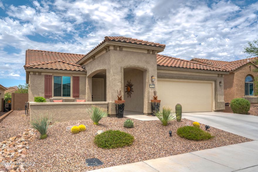 Exquisite newer 2BD/2BA+Den (1,858 sq ft) Sanctuary model in Del Webb at Dove Mountain boasts a front paver patio, open concept floor plan and views of several mountain ranges. Inviting foyer flows to gathering room with media wall, double sliding glass doors, large dining nook and sleek gourmet kitchen with center island, quartz countertops, built-in stainless appliances w/ gas cooktop and walk-in pantry. Private Owner's suite hosts a bay window, dual sink vanity plus large walk-in shower & closet. Front guest room adjoins Den. Extended 2-car garage, water softener & tankless water heater. Retreat to the rear covered patio with sunshade, extended paver patio and block privacy wall. View fence backs to common area with Tortolita Mountain views. Fabulous active adult community. A must see!