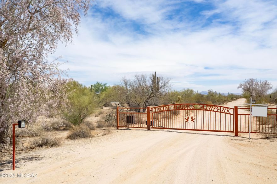 Beautiful 5.33 Acre lot in private, gated Twin Hawks Air Park. The site enjoys
panoramic views of multiple mountain ranges in the world famous Tucson Sonoran Desert. Build your dream custom home and hanger. Perfect homesite for any flying enthusiast. Close to the ever growing town of Marana with top rated schools, medical and veterinary
care, shopping, dining and much more. Easy access to Interstate 10, making travel to Phoenix and other destinations a breeze.
