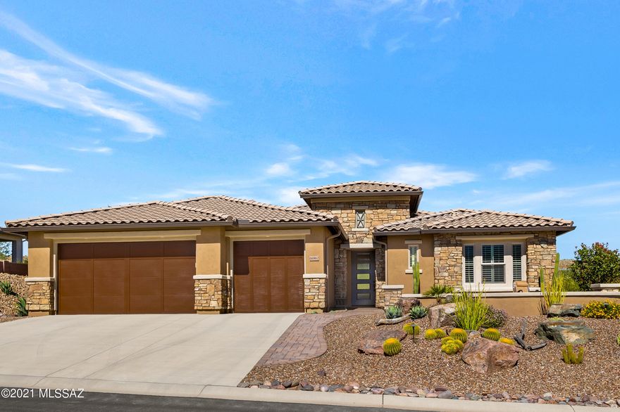 Stylish and modern 2018 Paloma model set on the 13th fairway of The Preserve Golf Course with views of the Catalina Mountains. Open concept 
features a great room with 11 ft ceiling, media wall, wet bar and glass doors to the deep covered patio.  Chef's delight kitchen includes a gas cook top, a butler's & walk-in panty, Stainless appliances, granite countertops with deco pendant lights and matching dining chandelier.  A guest suite with private bath plus a large den is perfect for a home office. Plantation shutters. quartz counters in all baths.  Owner's retreat includes his/hers walk-in closets with  ''California closet'' organizers a beautiful large shower & double vanity.  Artistic landscape includes paver patios front & back with a gas fire pit, water feature, & artificial turf.